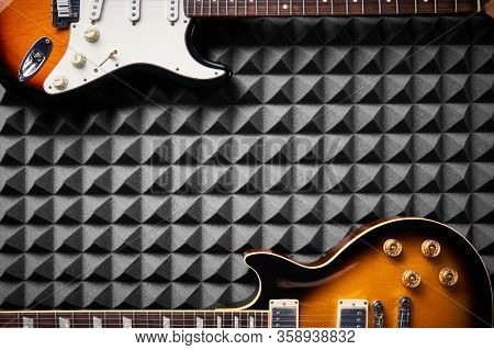 Top View Of Electric Guitar On Acoustic Foam Panel Background