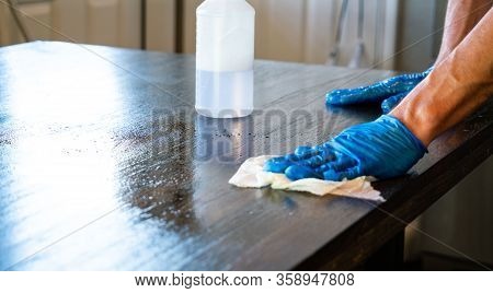 Wiping Down Surfaces And Disinfecting Table During Covid-19 Pandemic