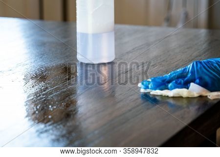 Wiping Down Surfaces And Disinfecting Table During Covid-19 Pandemic