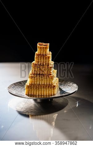 Layered Carrot Dessert Cake On Decorative Plate