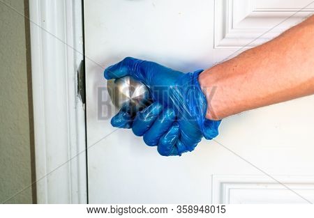 Hand With Blue Protective Glove Cleaning Barstool Wiping Down Surfaces For Covid-19 Pandemic