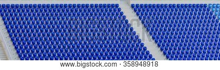 Empty Dark-blue Seats Atthe Stadium Before The Match