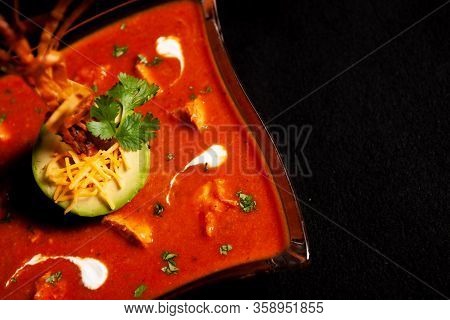 Seasoned Tomato Soup With Avocado And Decorations