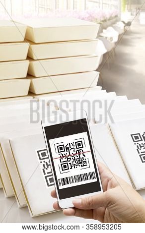 Online Order Food Shopping And Delivery Service On Touch Screen. Woman Hand Holding Smart Phone Scan