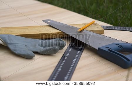 Carpenter At Work, Makes Crafts From Boards And Plywood