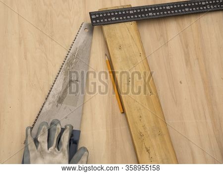 Carpenter At Work, Makes Crafts From Boards And Plywood