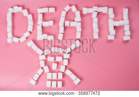 Deadly Sugar Addiction Suggested By Spilled White Sugar Crystals Forming A Skull On A Wooden Table