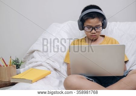 Asian Boy Enjoy Self Study With E-learning At Home.