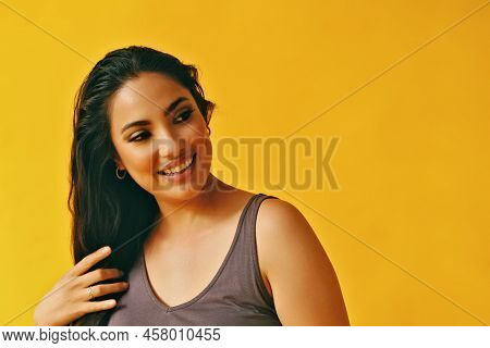 Headshot Beauty Shot Of Hispanic Latina Woman Smiling Young Adult With Hands On Hair Black Long Hair