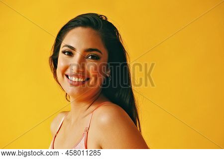 Headshot Beauty Shot Of Hispanic Latina Woman Toothy Smile Young Adult With Black Long Hair And Tank