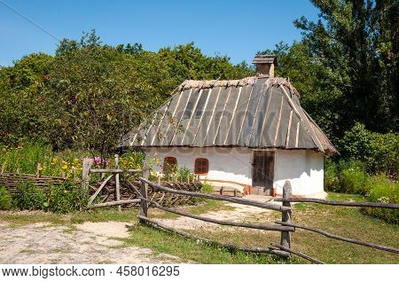 Authentic Old Village Thatched Hut Folk Architecture In Ethnographic Open-air Museum In Pyrohiv, Ukr