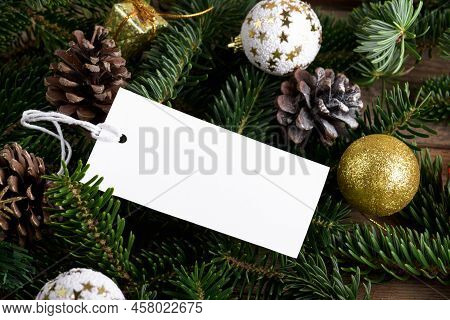 Christmas Rectangle White Tag Mockup With White Cord, Close Up On Natural Fir Tree Branch, With Cone