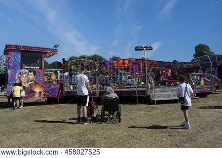 Grantham, Lincolnshire, England- July 9, 2022. People In Wyndham Park At Grantham Fun Fair.