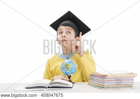 Student Looks Up Thoughtfully And Raised His Index Finger. Boy Had An Idea While Doing Homework. Str