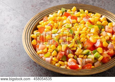 Sweet Corn Chat Or Steamed Yellow Sweet Corn, Chat Masala On A Plate Closeup In The Table. Horizonta