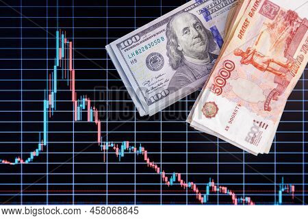 Us Dollar And Russian Ruble Banknotes Packs Over Digital Screen With Real Life Exchange Chart, Usd R