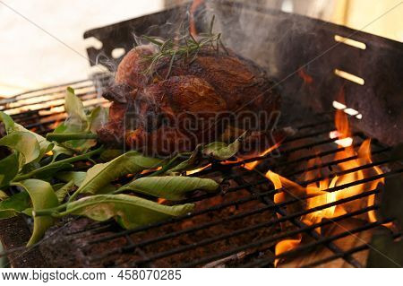 Roast Chicken Barbecue With Lemon Leaves, Outside Private House On A Public Holiday