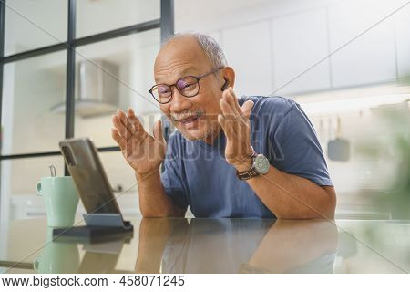 Cheerful Middle Aged Man Making Video Call On Smartphone With His Family, Chinese Senior Man Having 