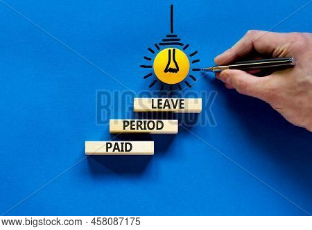 Paid Period Leave Symbol. Concept Words Paid Period Leave On Wooden Blocks. Beautiful Blue Table Blu