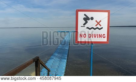 No Diving Sign At Beach, Lake Naroch, Belarus. Warning Sign Of Shallow Water. Warning Notice Sign Do