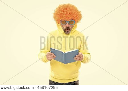 Senior Student In Funky Wig Read School Book In Sunglasses With Surprised Look, Knowledge