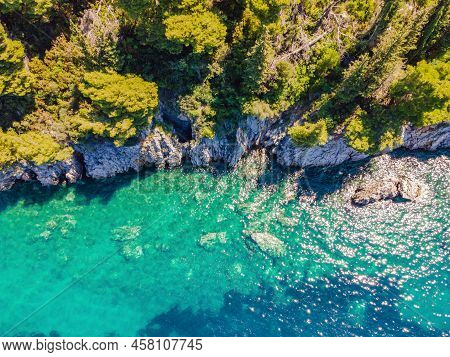 Picturesque Sea Adriatic Coast Of Montenegro. Turquoise Mediteran Sea And Rocky Shore With Evergreen
