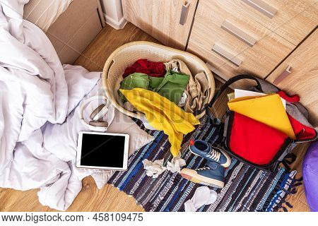 Colored Things Are Scattered On The Floor In A Big Mess, Top View. Teenage Room