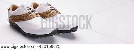 Close-up Of Pair Of Stylish Fashionable Shoes With Unique Design, White Leather Combines With Gold, 