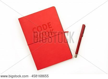 Red Hardcover Code Book And Red Pen Isolated On White Background With Copy Space. Clipping Parh Incl