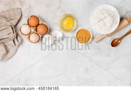Baking Homemade Cookies On Gray Kitchen Worktop With Ingredients -flour, Eggs,  Sugar And  Cinnamon.
