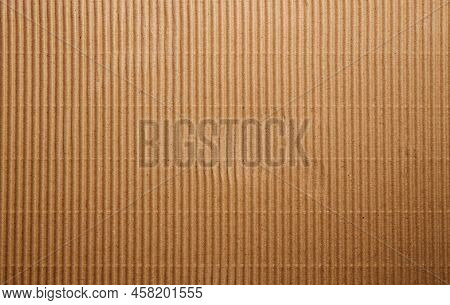Craft Striped Corrugated Paper Texture Background. Recycling Material. Closeup Shot