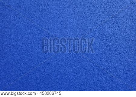 Backdrop - Wall With Coarse Vibrant Blue Roughcast Finish