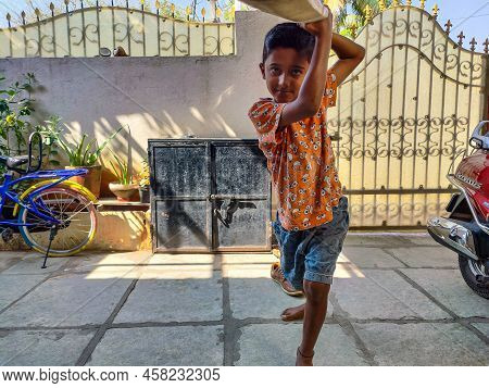 Gulbarga,india- February 15th 2021; Stock Photo Of Indian Kid Wearing Orange Color T Shirt And Short