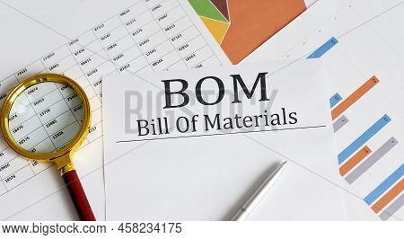 Bom - Bill Of Materials Text With Magnifying Glass Lens On Office Desk Table.