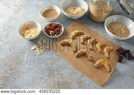 Baking Healthy Cookies From Almond, Oat Flakes And Dates With Dark Chocolate, Ingredients On A Rusti