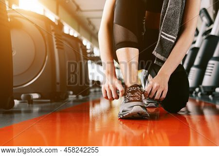 Sport Woman Tying Sneakers Rope. Sport Center And Fitness Gym Concept. Healthy And Body Build Up The
