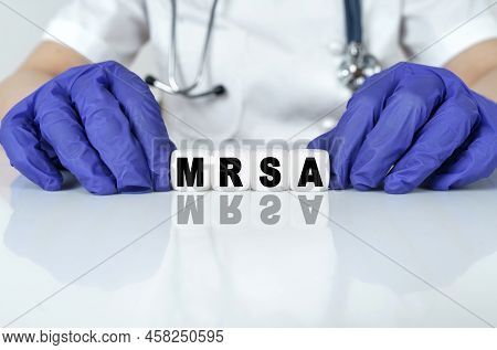 Medicine And Health Concept. The Doctor Put Together A Word From Cubes Mrsa. Methicillin-resistant S