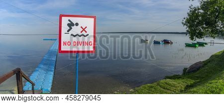 No Diving Sign At Beach, Lake Naroch, Belarus. Warning Sign Of Shallow Water. Warning Notice Sign Do