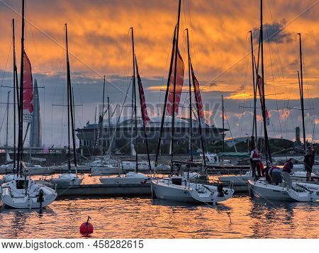 Russia, St. Petersburg, 12 July 2022: The Yacht Club With Piers And Sailing Boats Against The Backdr