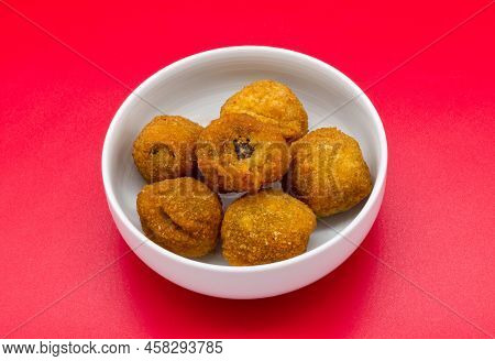 Italian Ascolane Olives, Olive Ascolane, In A Bowl Isolated On Red Background