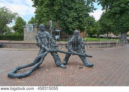 Delfzijl, Netherlands - 07 16 2022: Bronze Statue In The City Center Of Dutch Delfzijl