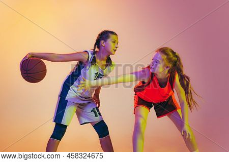 Attack And Defense. Female Basketball Players, Young Girls, Teen In Action With Basketball Ball Isol