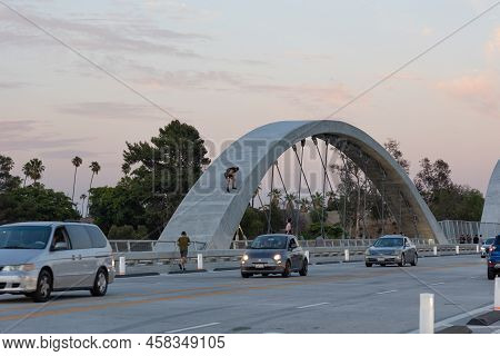 Los Angeles, Ca - July 14 2022:  A Daredevil Climbs On The New 6th Street Bridge In Los Angeles