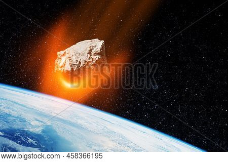 Planet Earth And Big Asteroid In The Space. Potentially Hazardous Asteroids. Asteroid In Outer Space