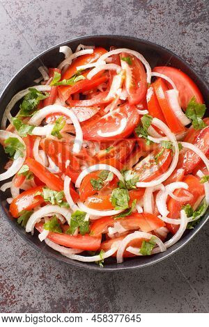Ensalada Chilena Is A Chilean Salad Consisting Of Tomatoes, Onions, Olive Oil, And Coriander Closeup
