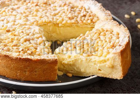 Authentic Italian Torta Della Nonna Custard Filled Tart Closeup In The Plate On The Table. Horizonta