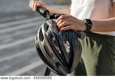 Young Woman Holding Protection Helmet For Riding