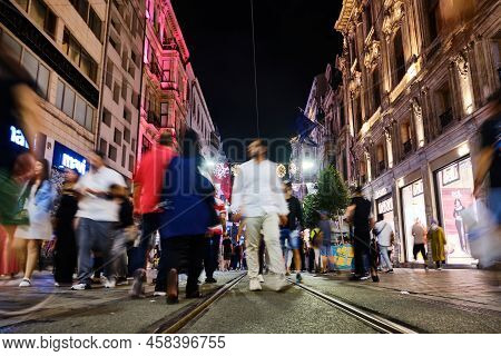 Crowds Of People Walking Down Istiklal Caddesi In The Summer Night. Long Exposure Shot. Istanbul, Tu