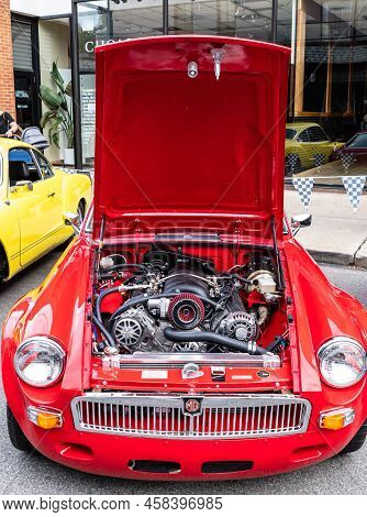Pittsburgh, Pennsylvania, Usa July 18, 2022 The Engine Compartment And Motor Of A Red Mg Coupe At Th