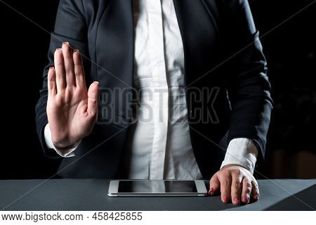 Businesswoman Having Tablet On Desk And Pointing Important Ideas With Hand. Woman With Phone Showing